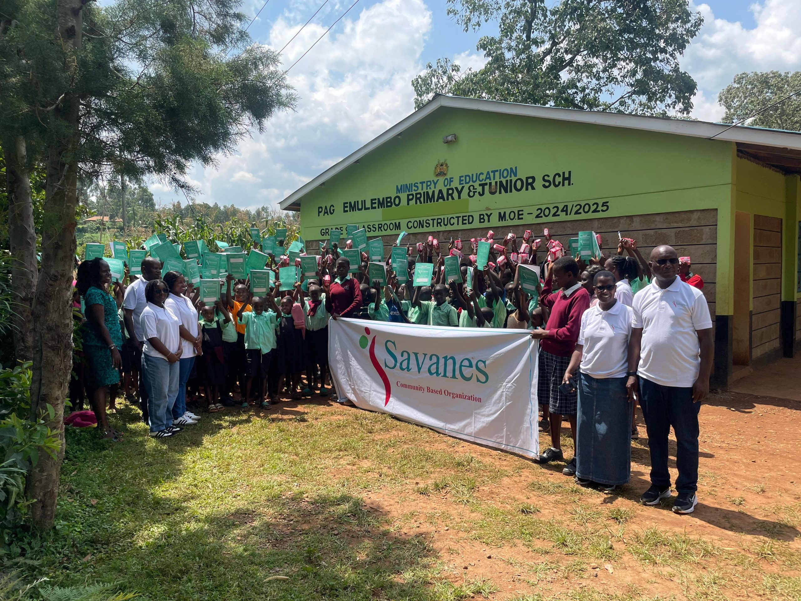 Savanes CBO distributing stationary at Emulembo Primary and JSS